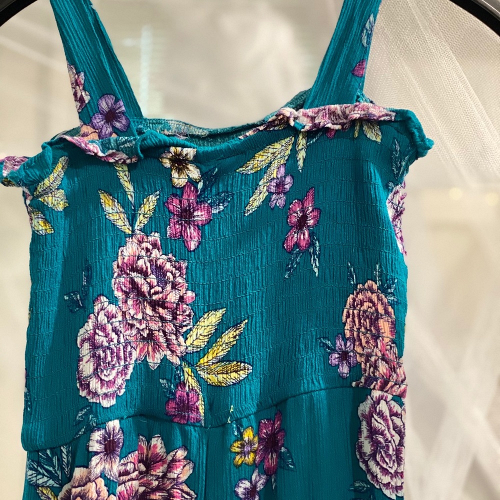 Teal flower print jumpsuit. Legs are capris, 7/8